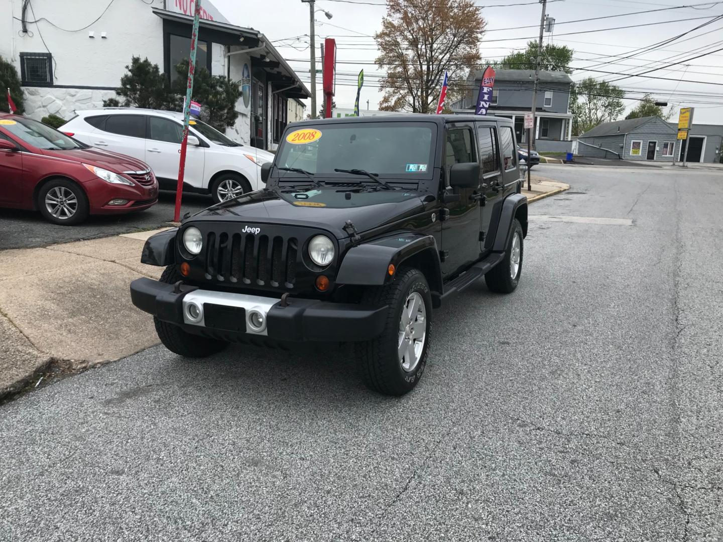 2008 Black /Black Jeep Wrangler Unlimited Sahara 4WD (1J8GA59198L) with an 3.8L V6 OHV 12V engine, Automatic transmission, located at 577 Chester Pike, Prospect Park, PA, 19076, (610) 237-1015, 39.886154, -75.302338 - Photo#2